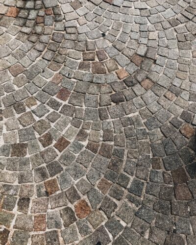 A Grey and brown colored cobblestone street makes a great background
